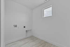 Laundry room with electric dryer hookup and hookup for a washing machine