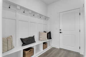 Mudroom with light wood-style flooring