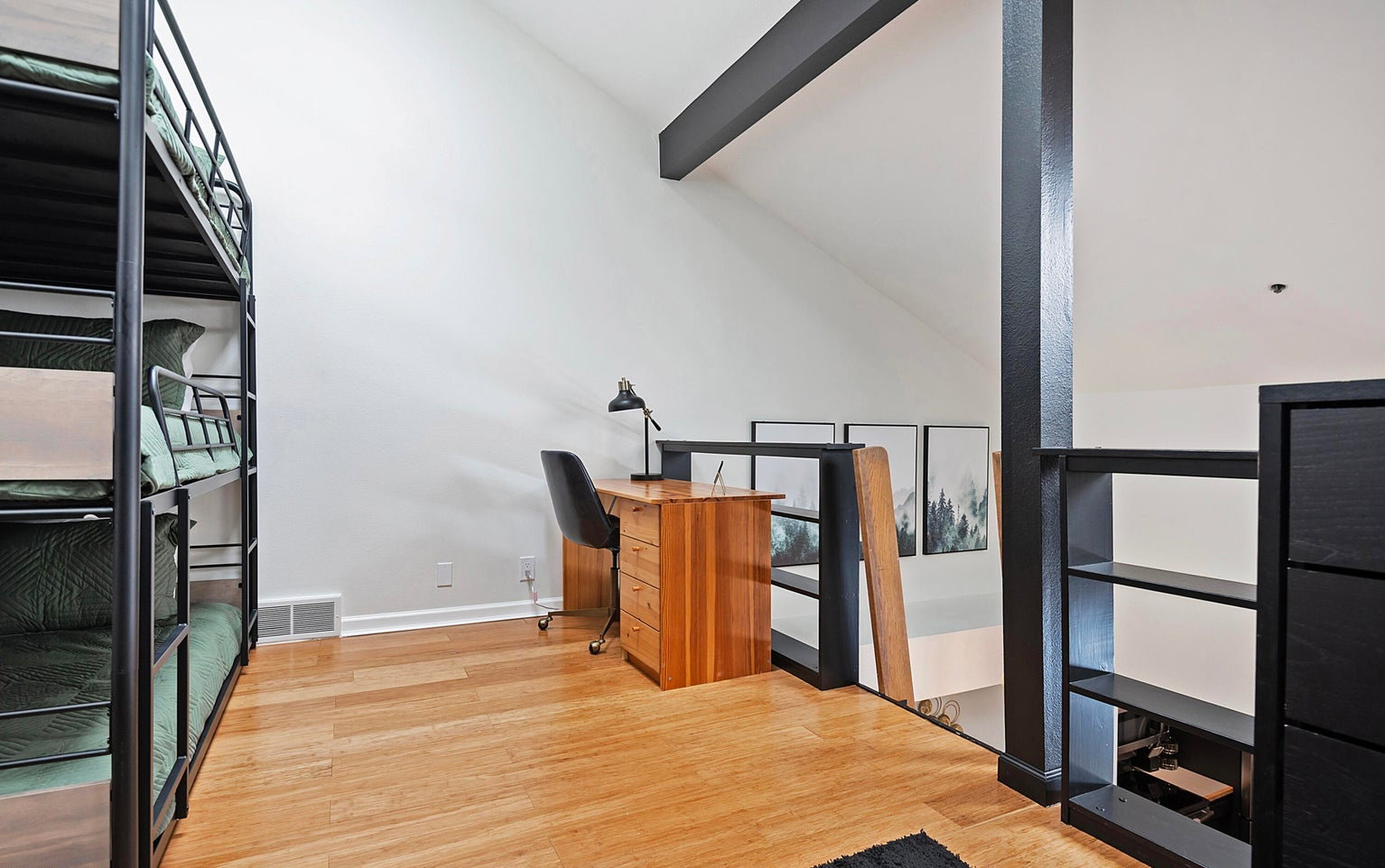 Unfurnished office featuring light wood-type flooring and lofted ceiling