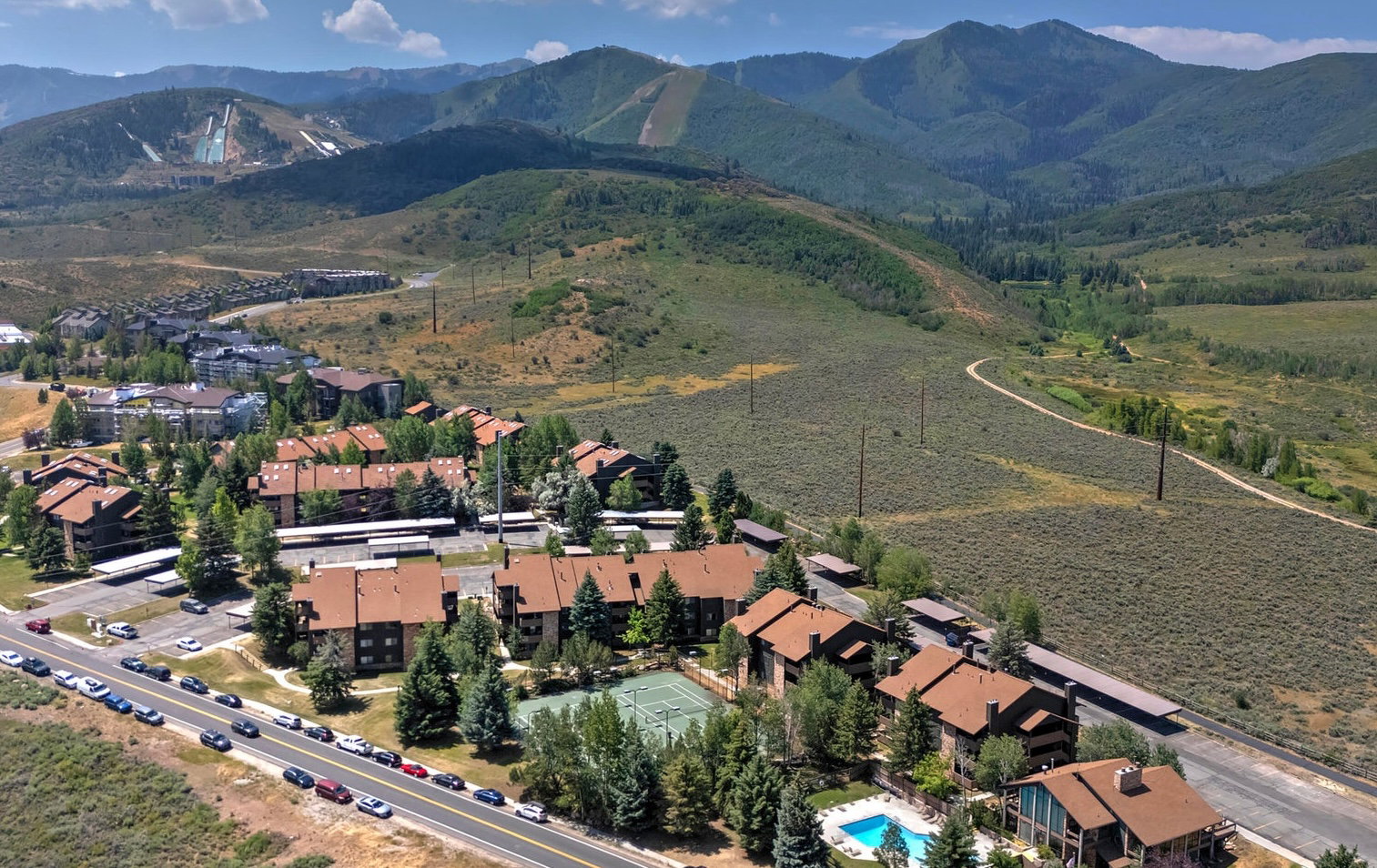 Aerial view of property's location with a mountainous background