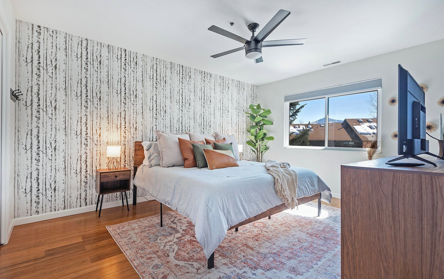Bedroom with wood finished floors and a ceiling fan