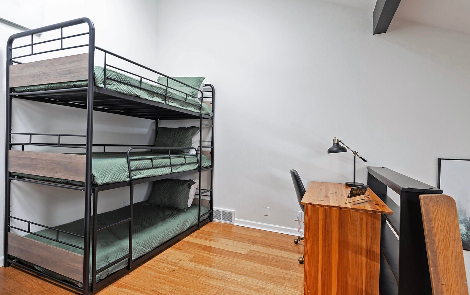 Unfurnished bedroom featuring light wood-style floors and baseboards