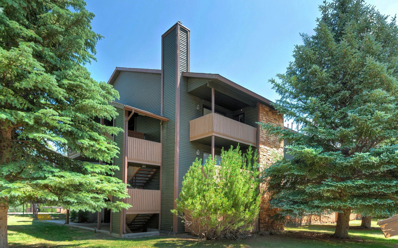 View of apartment building / complex with stairs