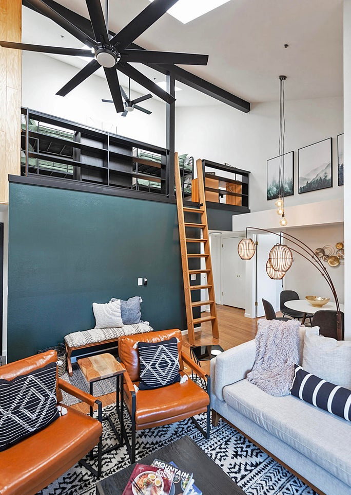 Living room featuring wood finished floors and ceiling fan