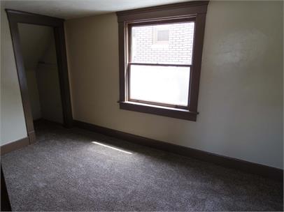 Unfurnished bedroom featuring a closet and carpet floors