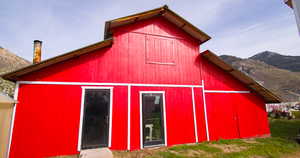 View of barn featuring a mountain view