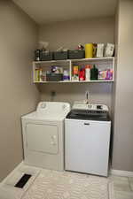 Laundry area with cupboard space, linen closet and counter for folding clothes.  There is also a sink in the laundry room.