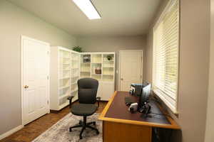 Home office featuring parquet floors