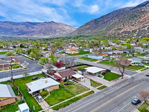 Aerial view of residential area featuring a mountainous background