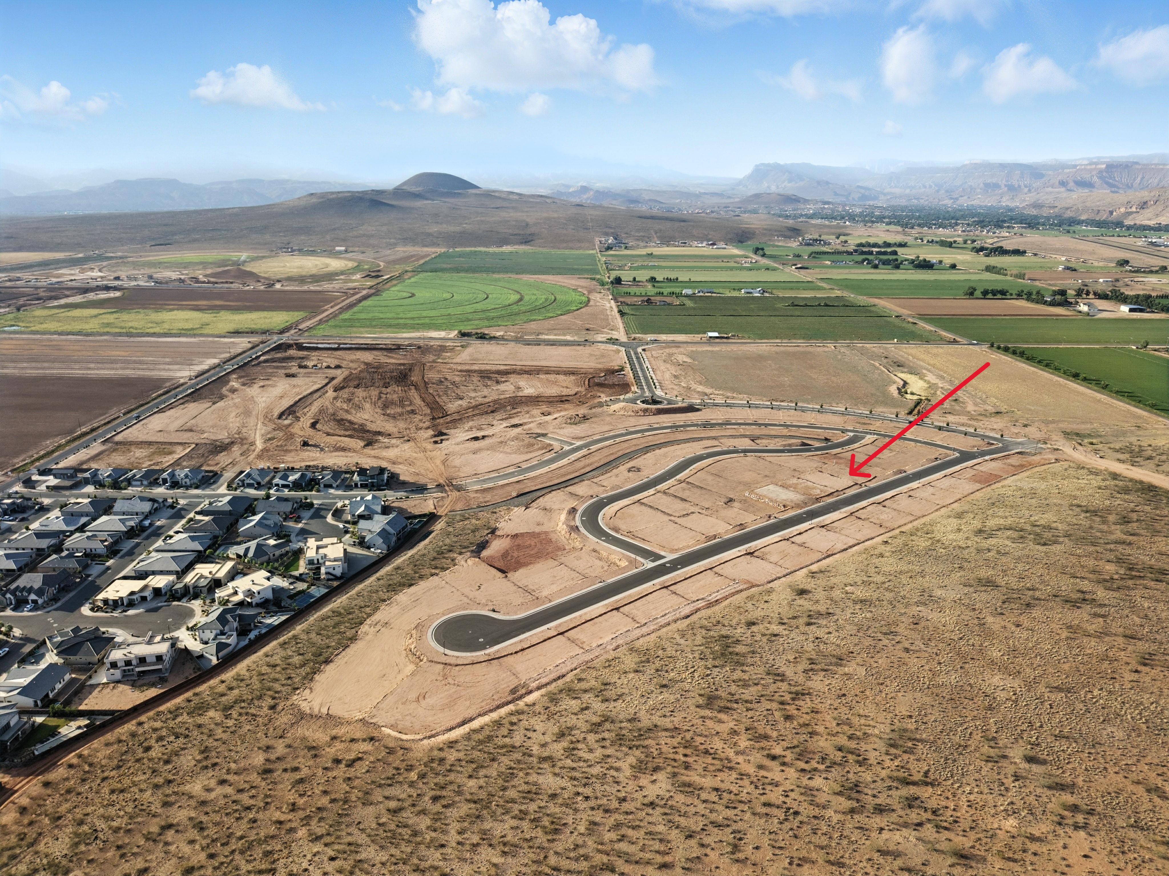 Overview of rural landscape with mountains and nearby suburban area
