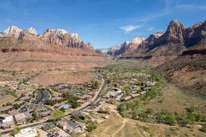 View of mountain backdrop featuring nearby suburban area