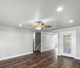Spare room featuring recessed lighting, a ceiling fan, and dark wood-style floors