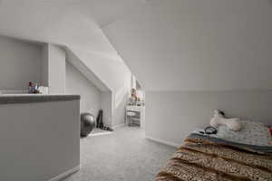 Bedroom featuring baseboards and light colored carpet