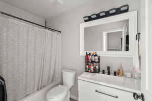 Full bathroom with vanity and shower / tub combo with curtain