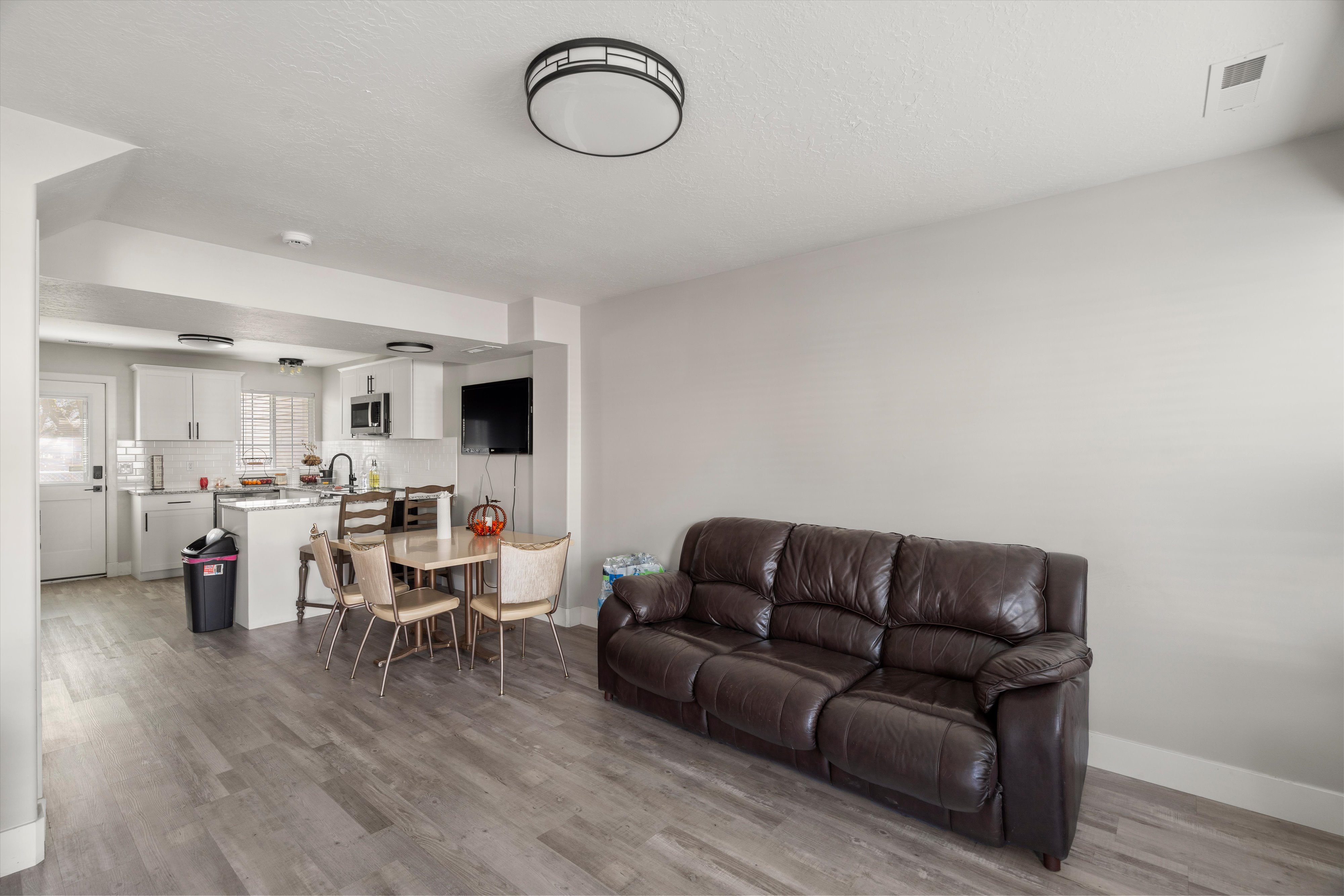 Living room featuring light wood finished floors and baseboards