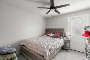 Bedroom with light carpet and ceiling fan