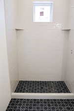 Full bath with a shower stall