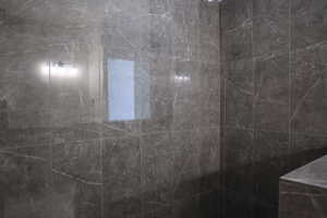 Full bathroom featuring a tile shower