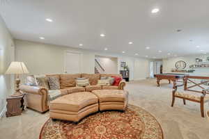 Living room featuring recessed lighting, light colored carpet, and billiards