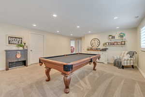 Game room with light colored carpet, recessed lighting, and billiards