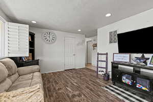 #815 with new LVT, recessed lighting, and a textured ceiling.