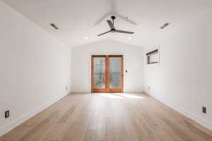 Spare room featuring light wood-type flooring and a ceiling fan