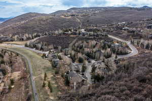 Aerial perspective of suburban area with a mountainous background