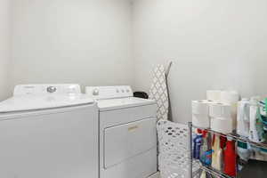 Laundry area featuring separate washer and dryer