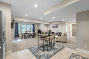 Dining room featuring light carpet and recessed lighting