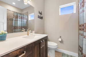 Bathroom with vanity and a shower with curtain