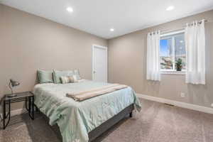 Bedroom featuring carpet and recessed lighting