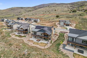 Aerial view of residential area featuring mountains
