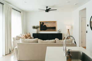 Living area featuring a ceiling fan