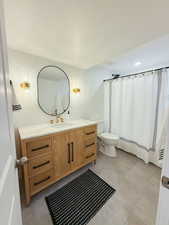 Bathroom featuring vanity and a shower with curtain