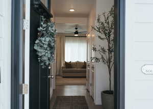 Hall featuring dark wood-type flooring