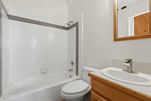 Full bath featuring vanity and bathing tub / shower combination