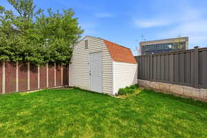 View of shed featuring a fenced backyard