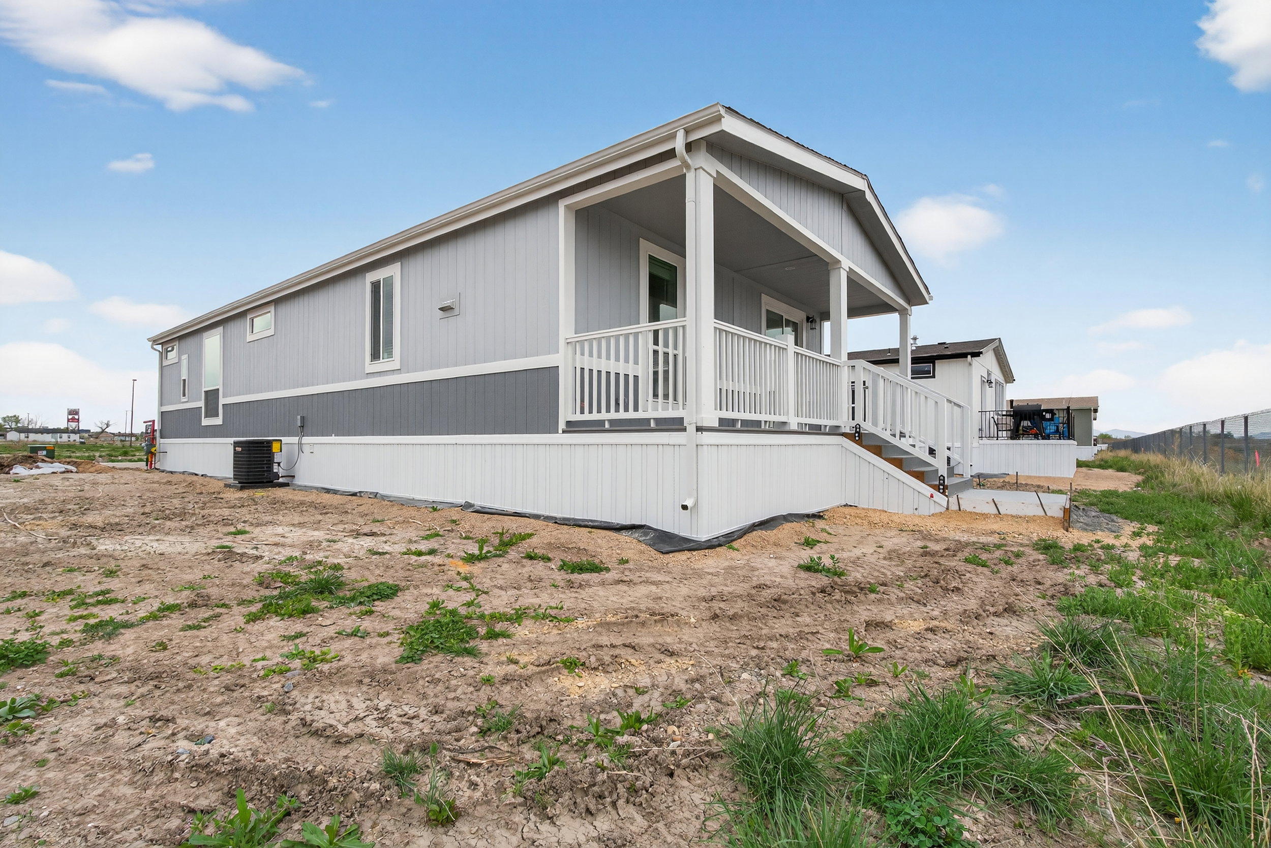 Back of property featuring covered porch