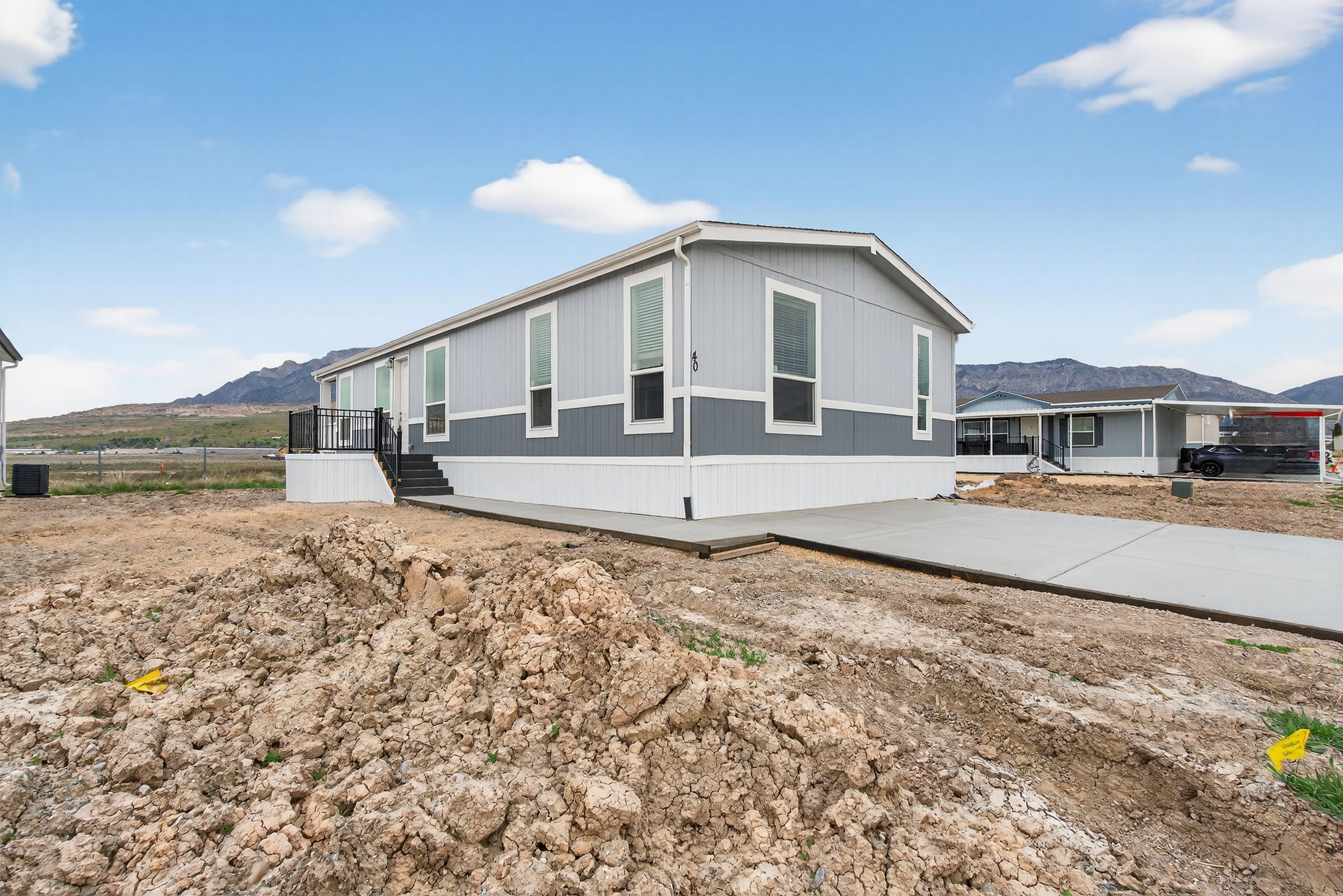 View of side of property with a mountain view