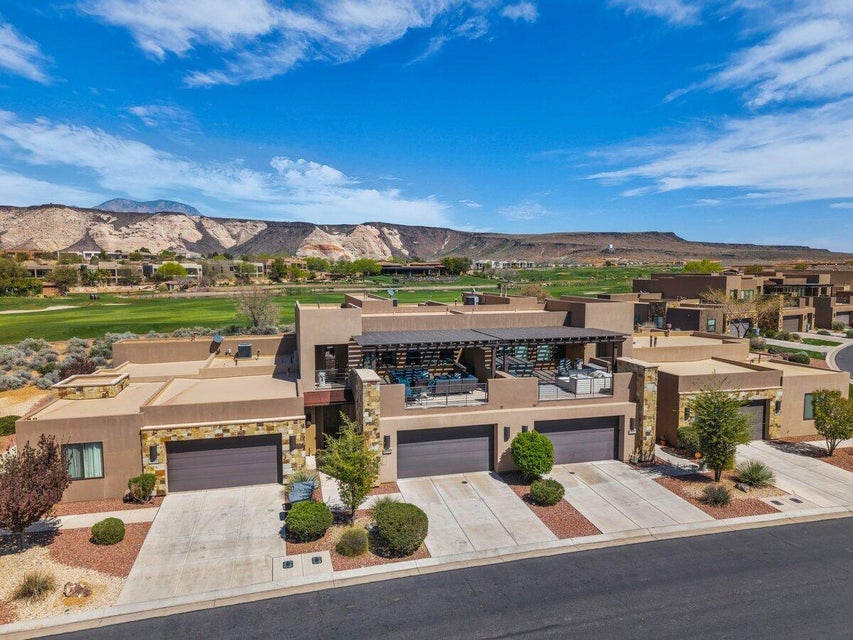 Aerial perspective of suburban area with a mountainous background