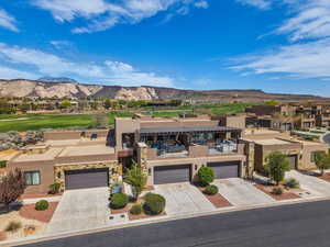 Aerial perspective of suburban area with a mountainous background