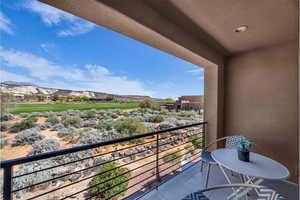 Balcony featuring a mountain view and view of golf course