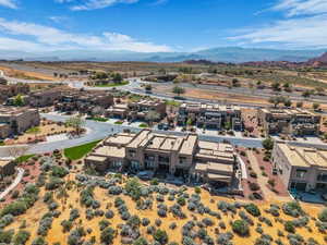 Aerial perspective of suburban area with a mountainous background