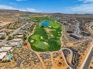 Aerial view of residential area with a water and mountain view and a local golf course