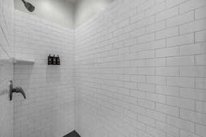 Full bath with a tile shower