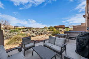 View of patio featuring an outdoor living space and area for grilling