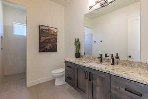Full bathroom featuring vanity, walk in shower, and light tile patterned floors