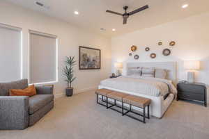Bedroom with light carpet, ceiling fan, and recessed lighting