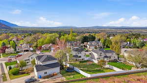 Aerial perspective of suburban area featuring a mountainous background