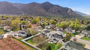 Aerial perspective of suburban area featuring a mountain backdrop